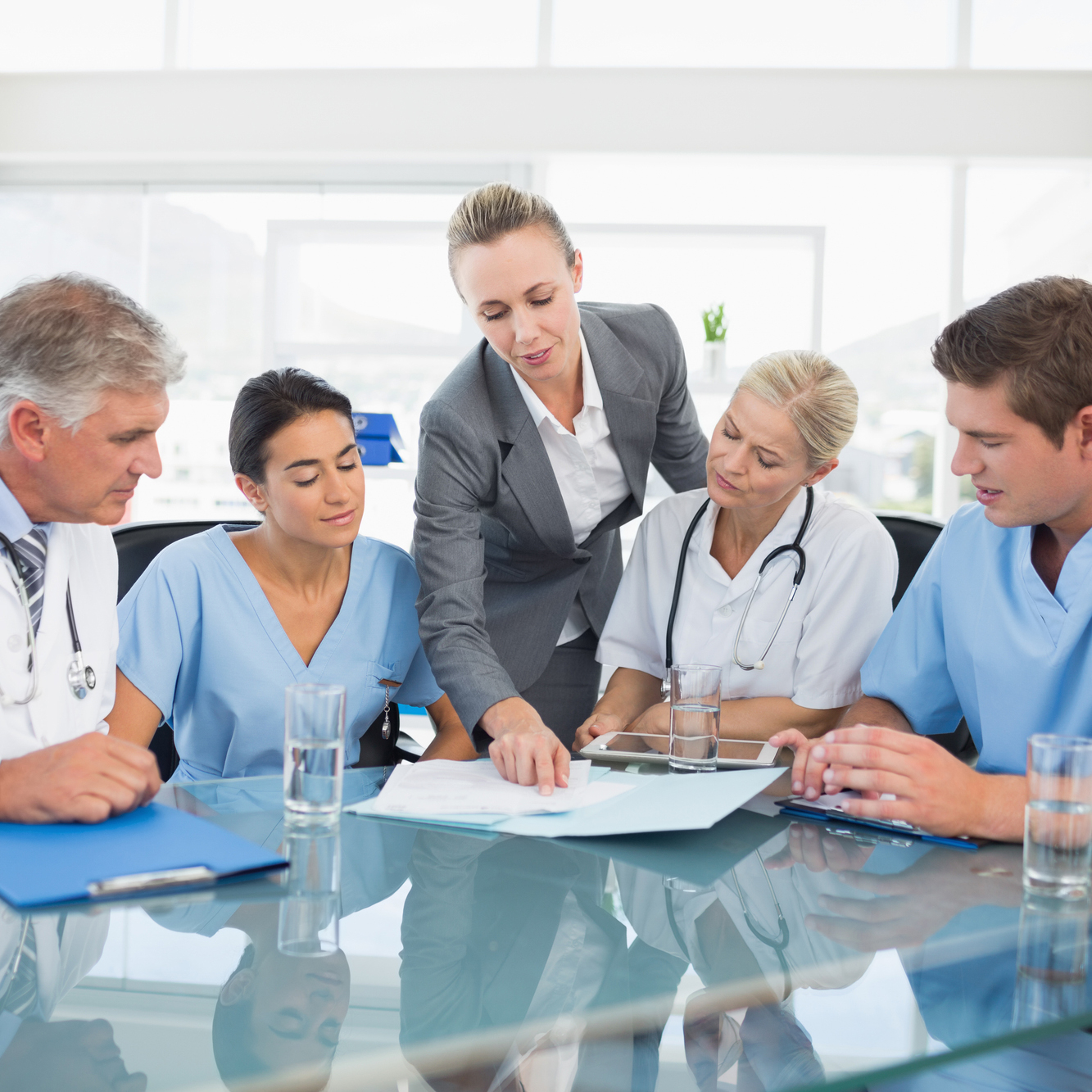Team Of Healthcare Workers Having A Meeting In Medical Office