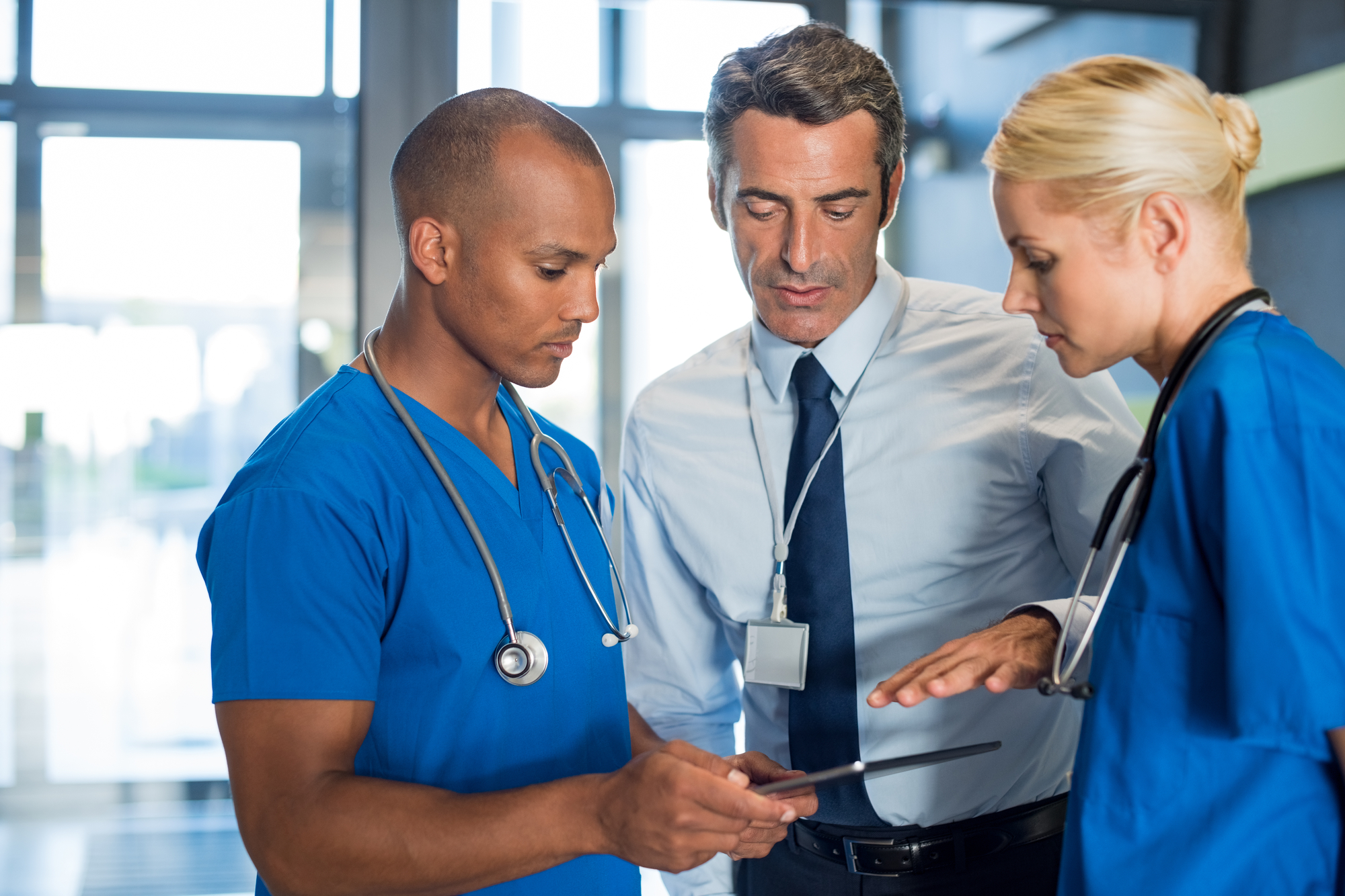 Medical Team Interacting Using Digital Tablet